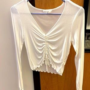 White long sleeve ribbed shirt.